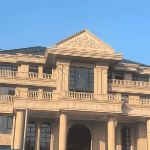 绵阳黄金麻别墅外墙干挂石材效果示例